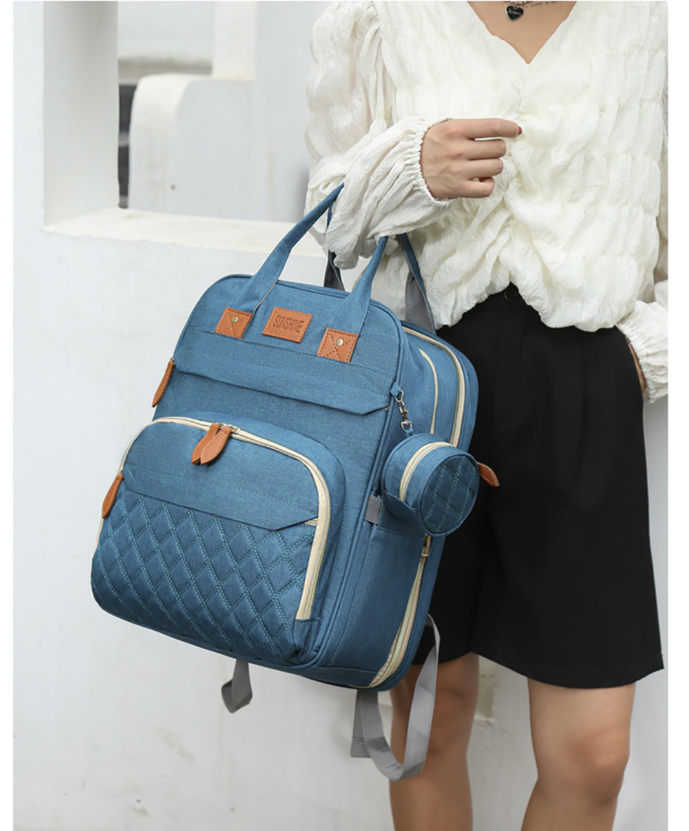 2-in-1 Nappy Backpack with fold out Travel Cot