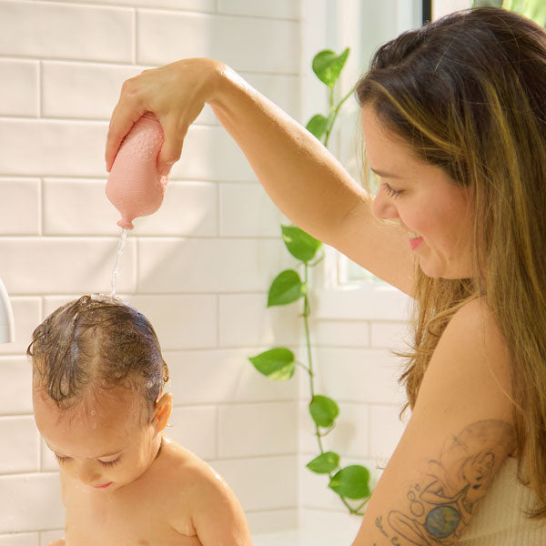 BabySqueezy is a 3-in-1: Newborn Bath Rinser, Teether & Toy