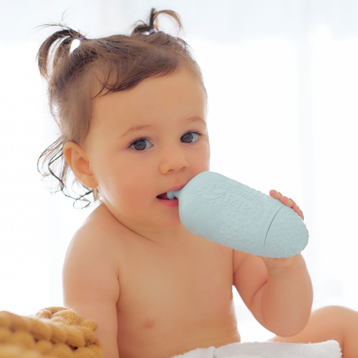 BabySqueezy is a 3-in-1: Newborn Bath Rinser, Teether & Toy