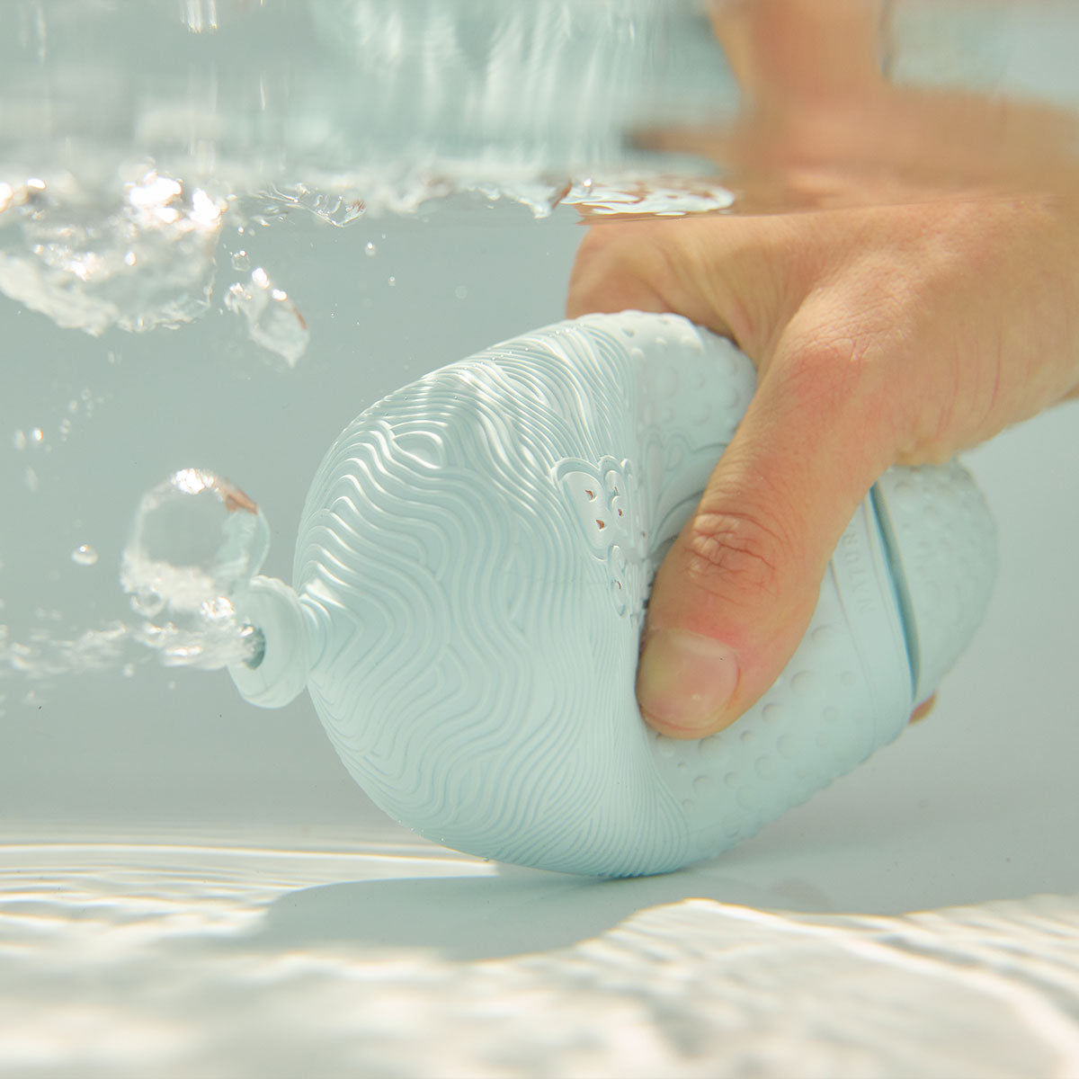 BabySqueezy is a 3-in-1: Newborn Bath Rinser, Teether & Toy