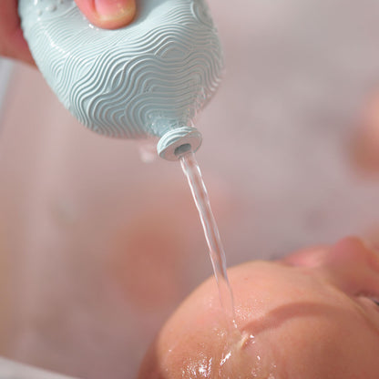 BabySqueezy is a 3-in-1: Newborn Bath Rinser, Teether & Toy