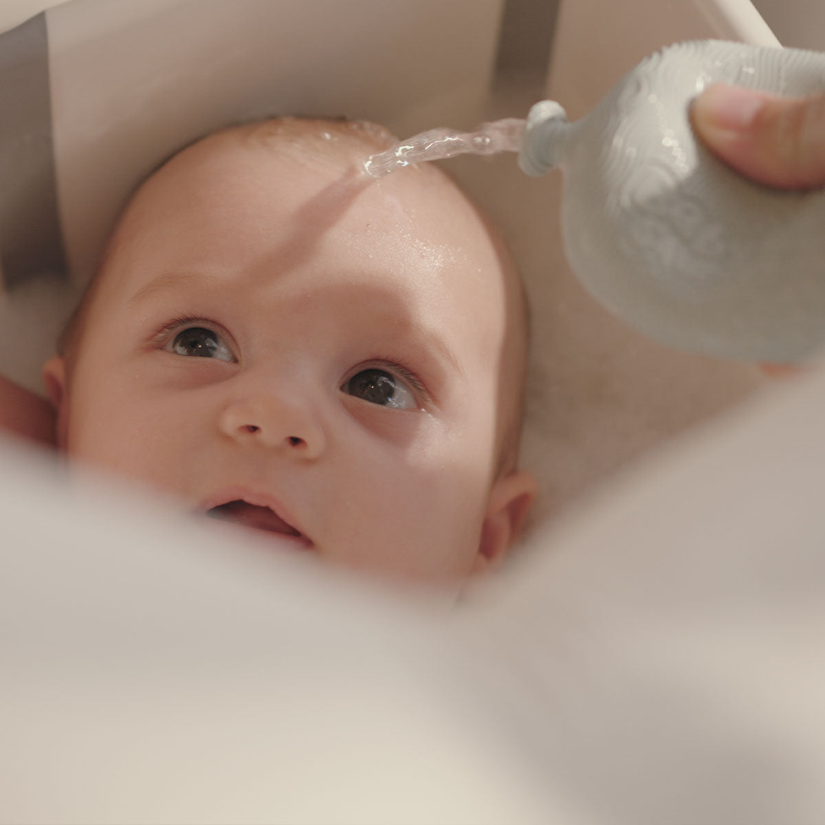 BabySqueezy is a 3-in-1: Newborn Bath Rinser, Teether & Toy