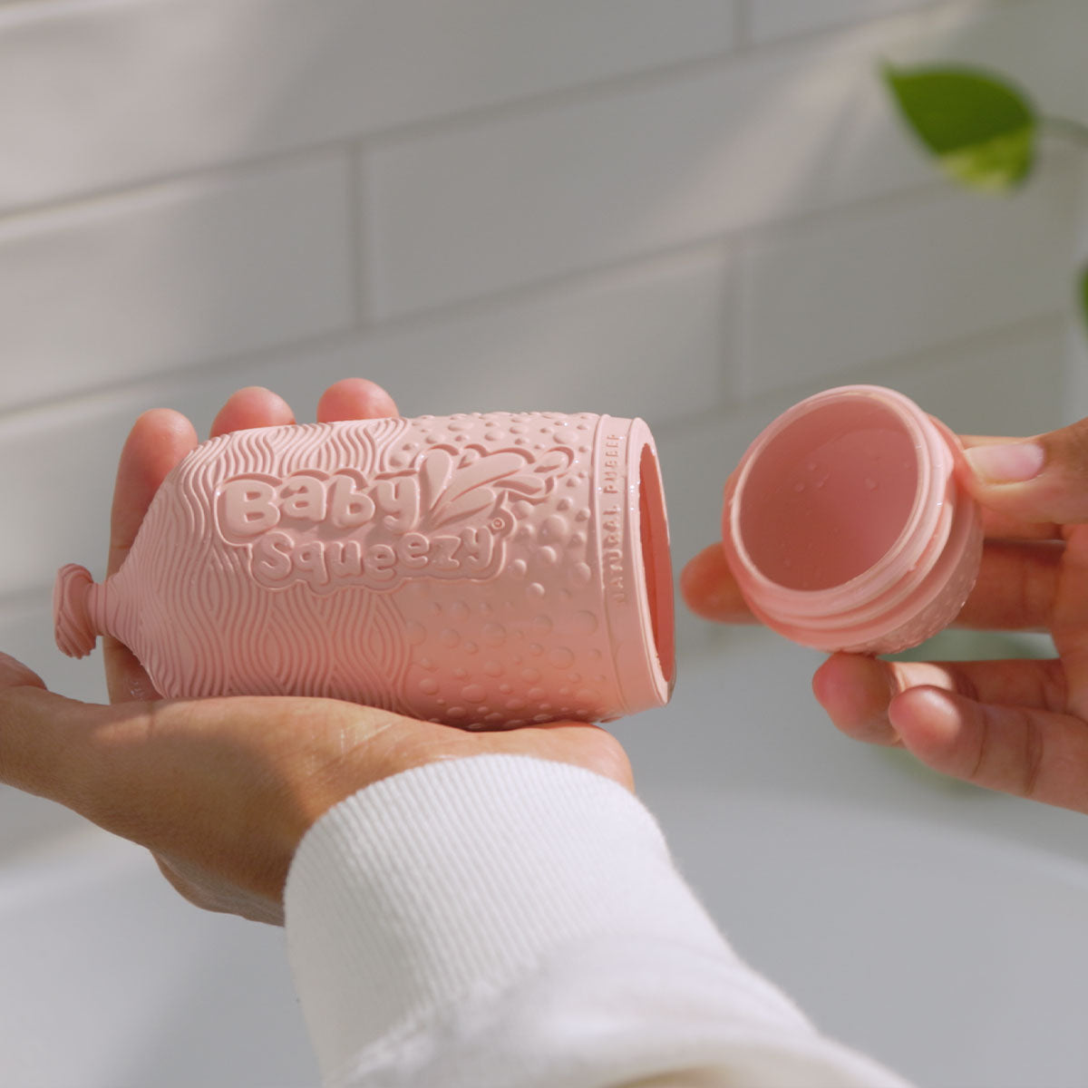 BabySqueezy is a 3-in-1: Newborn Bath Rinser, Teether & Toy