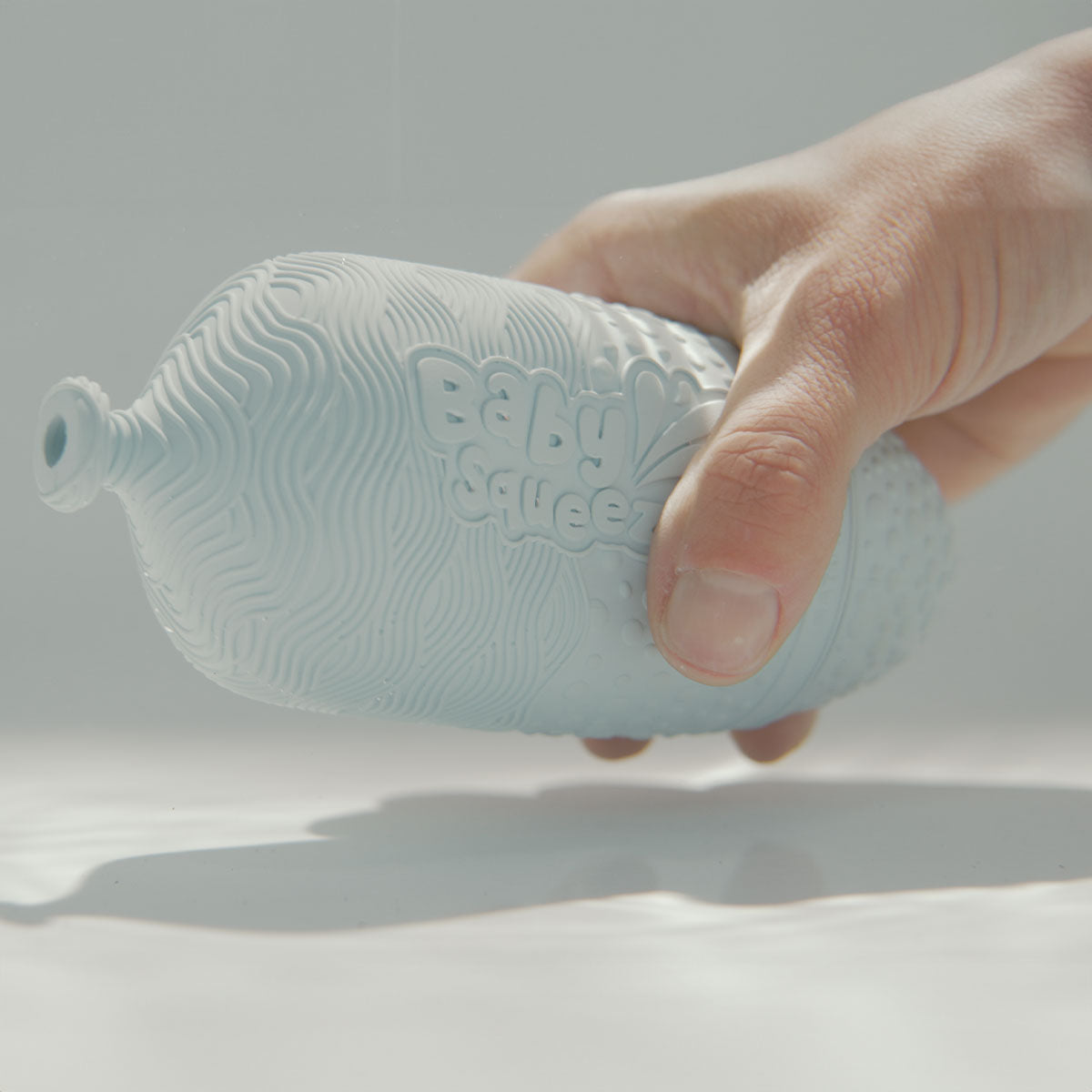 BabySqueezy is a 3-in-1: Newborn Bath Rinser, Teether & Toy