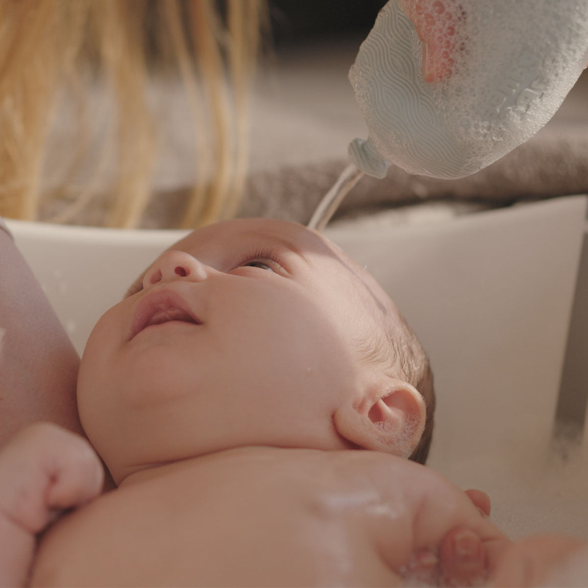 BabySqueezy is a 3-in-1: Newborn Bath Rinser, Teether & Toy