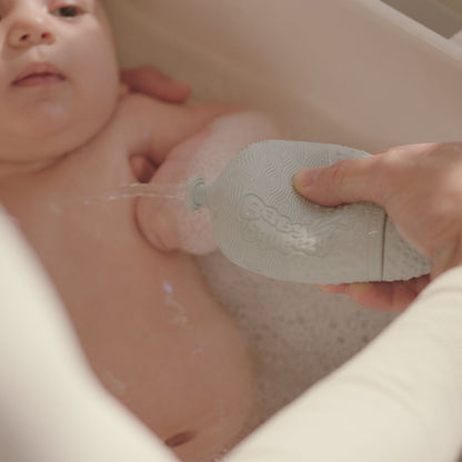 BabySqueezy is a 3-in-1: Newborn Bath Rinser, Teether & Toy