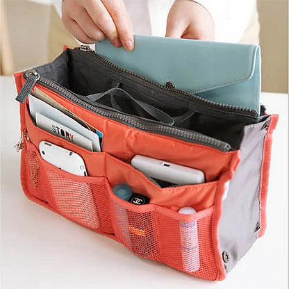 compact bag organiser insert with various compartments, can contain cosmetics, hair items, perfume, creams, keys, electronic devices, all handbag necessities