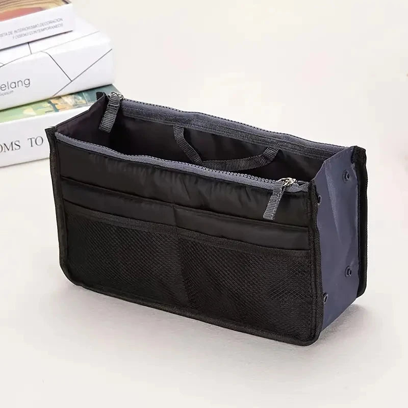 compact bag organiser insert with various compartments, can contain cosmetics, hair items, perfume, creams, keys, electronic devices, all handbag necessities