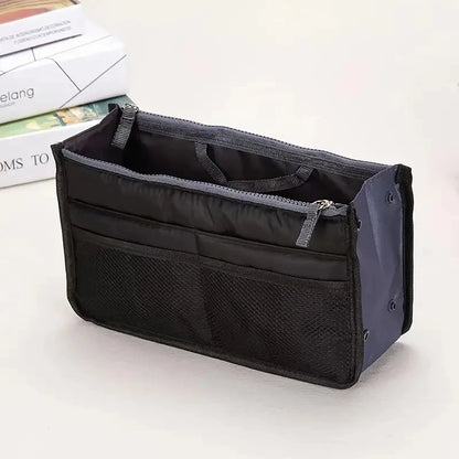 compact bag organiser insert with various compartments, can contain cosmetics, hair items, perfume, creams, keys, electronic devices, all handbag necessities