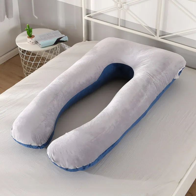 gray / blue pregnancy bump support pillow with a solid pattern.