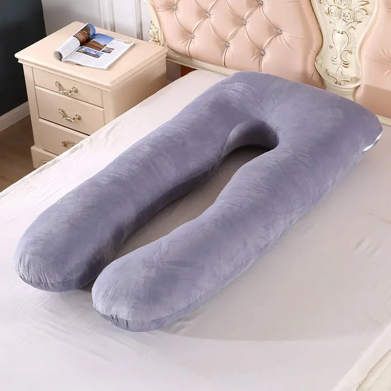 light gray pregnancy bump support pillow with a solid pattern.